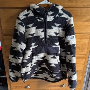 The North Face Black and Cream Zip-Up Hooded Fleece in good used condition